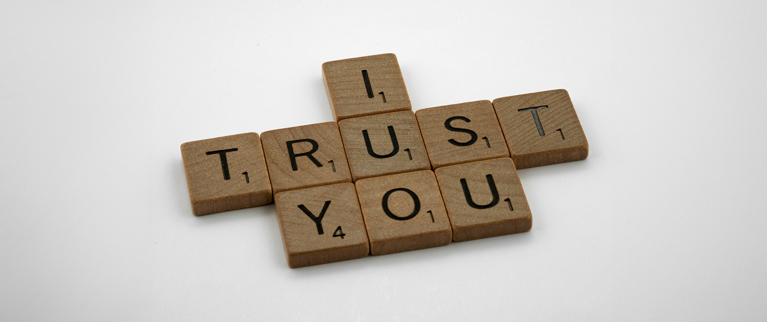 Photo of Scrabble blocks spelling out 'I Trust You'